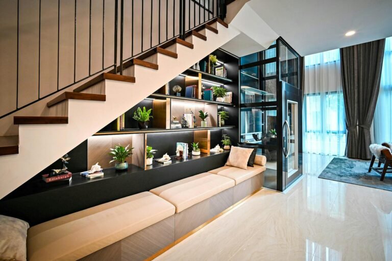 Contemporary living space featuring sleek shelves and stairs with elegant decor elements.