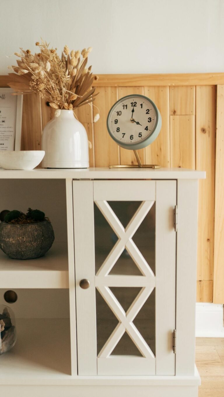 Scandinavian style shelf with clock and decor creating a cozy ambiance.