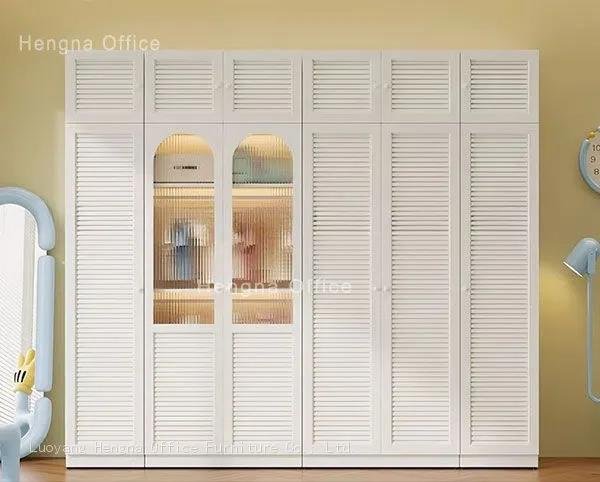 Modern steel bedroom wardrobe with adjustable shelving and hanging rod in a contemporary bedroom